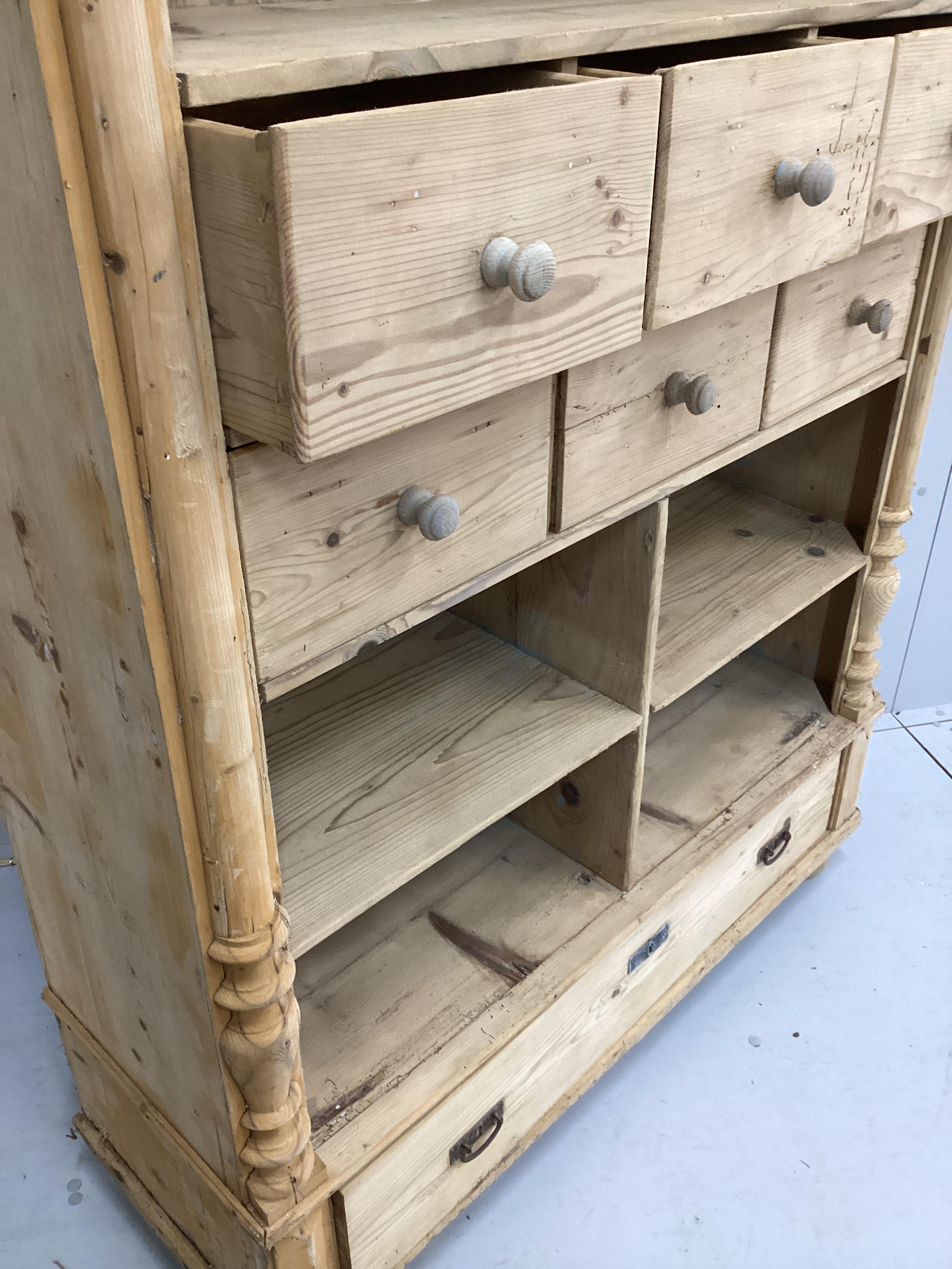 A 19th century East European pine kitchen cabinet, width 120cm, depth 44cm, height 187cm